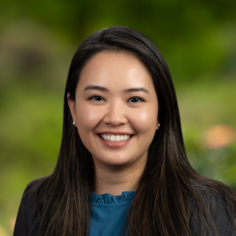 Dr. Angelia Wang smiling outdoors